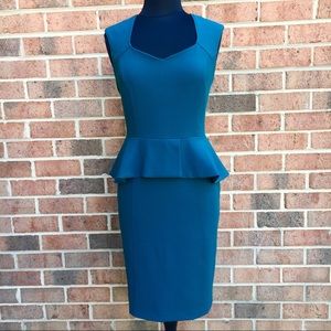 Body perfecting peplum sheath dress